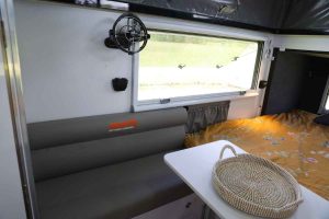 Infinity 15 Off Road Pop Top Hybrid Camper - sofa and fold away table