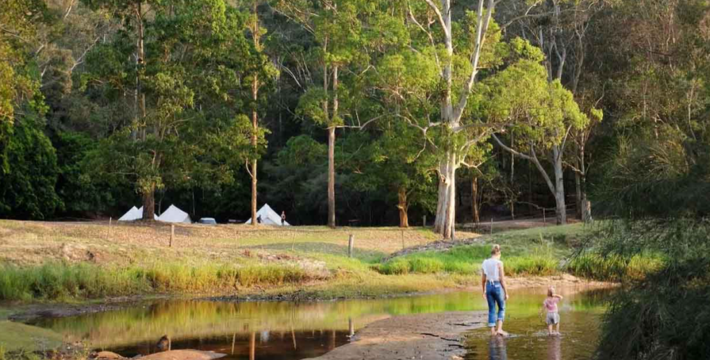 Top Destinations Within Two Hours of Sydney for Camping - Mother and toddler playing in creek at Glenworth Valley