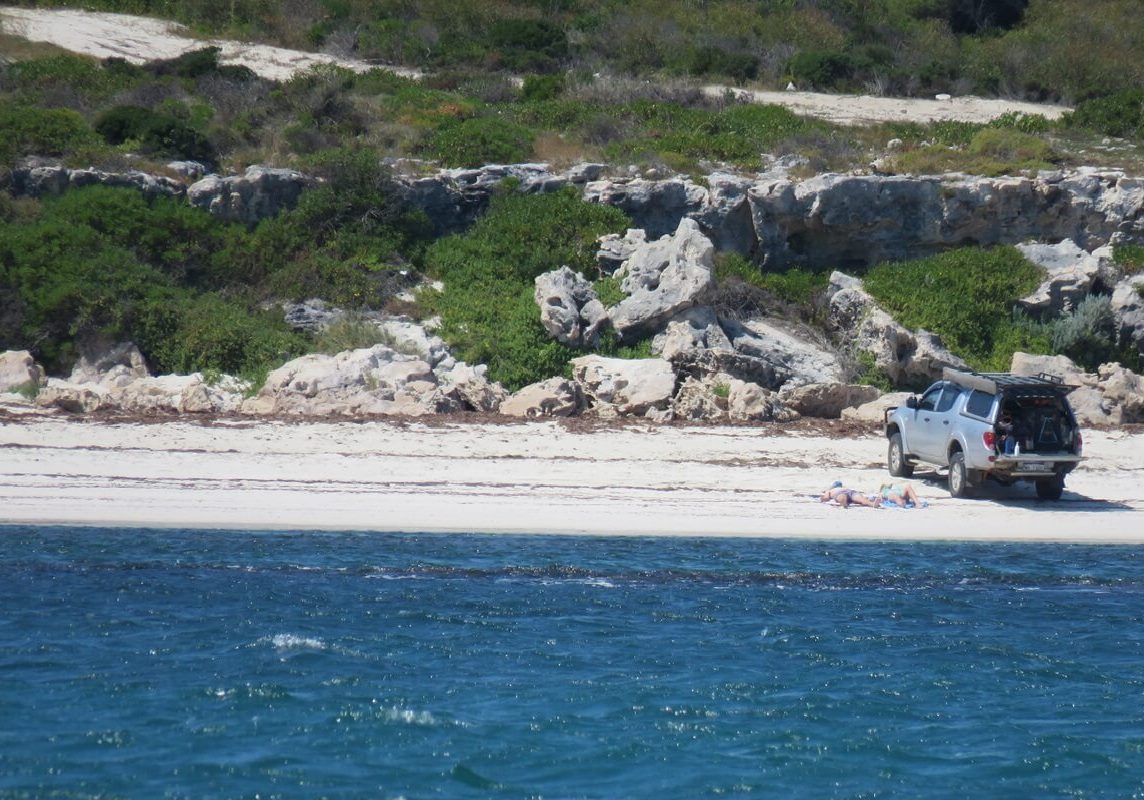 People and 4WD on beach in Jurien Bay area, Western Australia - a great spot for off road caravanning